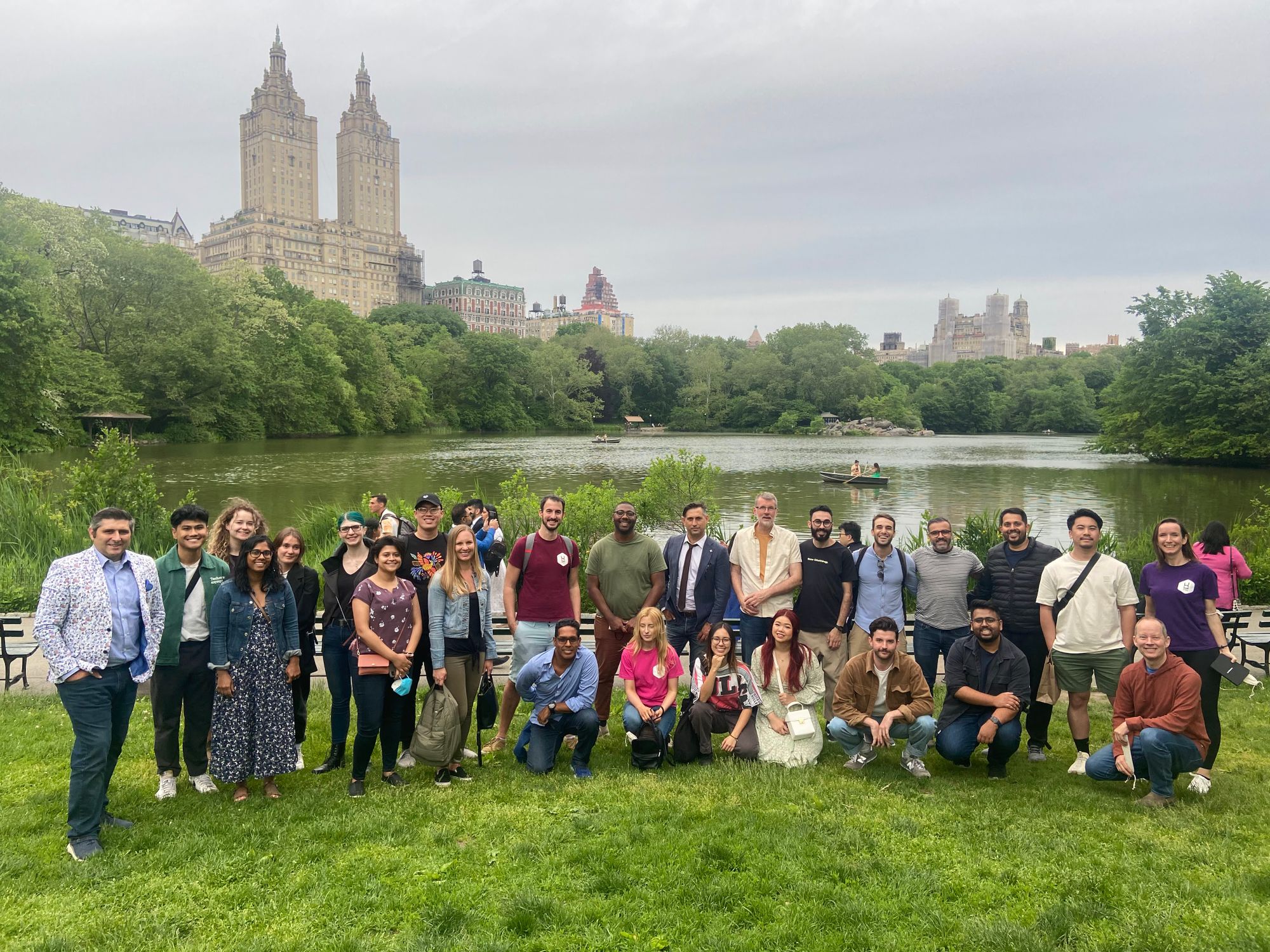 Around 30 people posing for a photo in central park as part of the UXDX USA walking tour