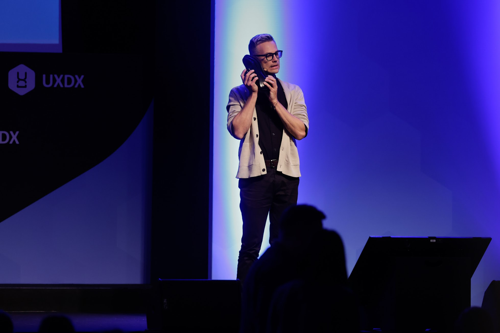 Andrew Birgiolas on stage at UXDX EMEA - "From Silos to Synergy: Cross-Functional Mechanisms for Design, Product, and Engineering Leaders"